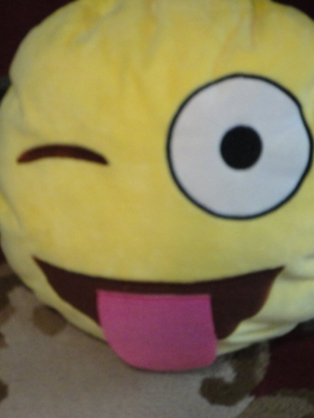 Yellow Emoji Pillow Blinking Eye Tongue Out
